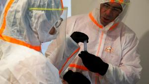 A French doctor, wearing a protective suit and a face mask, holds a test tube before administering a nasal swab to a 6-year-old child during a COVID-19 testing in Gouzeaucourt, during the outbreak of the coronavirus disease (COVID-19) in France, May 16, 2020. REUTERS/Pascal Rossignol(REUTERS) A French doctor, wearing a protective suit and a face mask, holds a test tube before administering a nasal swab to a 6-year-old child during a COVID-19 testing in Gouzeaucourt, during the outbreak of the coronavirus disease (COVID-19) in France, May 16, 2020. REUTERS/Pascal Rossignol(REUTERS)