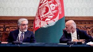 Afghan President Ashraf Ghani (R) and his rival Abdullah Abdullah (L) interact with eachother ahead of signing a power-sharing deal agreement at the Presidential Palace in Kabul.(AFP) Afghan President Ashraf Ghani (R) and his rival Abdullah Abdullah (L) interact with eachother ahead of signing a power-sharing deal agreement at the Presidential Palace in Kabul.(AFP)