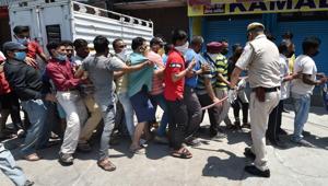 People violate social distancing norms as they stand in a queue to buy alcohol after authorities permitted the opening of liquor shops with certain restrictions, during the ongoing COVID-19 nationwide lockdown, at Jheel Khurenja in East Delhi, Tuesday, May 5, 2020.(PTI) People violate social distancing norms as they stand in a queue to buy alcohol after authorities permitted the opening of liquor shops with certain restrictions, during the ongoing COVID-19 nationwide lockdown, at Jheel Khurenja in East Delhi, Tuesday, May 5, 2020.(PTI)
