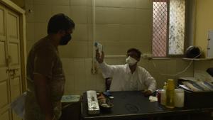 Mumbai, India - 18 May 2020: BMC clinic doctor doing thermal checking at BMC clinic, Worli Village in Mumbai, India, on Monday, May 18, 2020. (Photo by Pramod Thakur/ Hindustan Times)(Hindustan Times) Mumbai, India - 18 May 2020: BMC clinic doctor doing thermal checking at BMC clinic, Worli Village in Mumbai, India, on Monday, May 18, 2020. (Photo by Pramod Thakur/ Hindustan Times)(Hindustan Times)