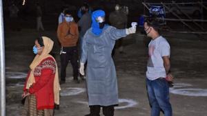 Migrants from Uttarkashi undergo thermal screening as they arrive at Chinyalisour by government buses during a government-imposed nationwide lockdown as a preventive measure against the coronavirus, in Uttarkashi on May 9.(ANI) Migrants from Uttarkashi undergo thermal screening as they arrive at Chinyalisour by government buses during a government-imposed nationwide lockdown as a preventive measure against the coronavirus, in Uttarkashi on May 9.(ANI)