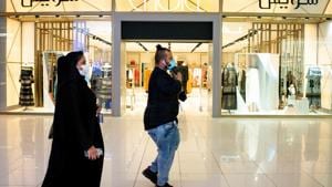 Pedestrians wear protective face masks while visiting a shopping mall and open retail stores in Riyadh, Saudi Arabia, on Tuesday, May 19. 2020. Before the pandemic, most shops, pharmacies and gas stations in the kingdom halted for at least 30 minutes for each prayer session, the only country that enforced such closures.(Bloomberg)