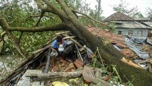 A man salvages items from his house damaged by cyclone Amphan in Midnapore, West Bengal, on May 21, 2020.(AFP) A man salvages items from his house damaged by cyclone Amphan in Midnapore, West Bengal, on May 21, 2020.(AFP)
