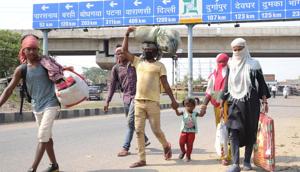 Family members of migrant labourer on foot proceeding from Delhi to their native place , during the nationwide COVID-19 lockdown, in Dhanbad, Tuesday on May 19, 2020.(Chandan Paul/ HT) Family members of migrant labourer on foot proceeding from Delhi to their native place , during the nationwide COVID-19 lockdown, in Dhanbad, Tuesday on May 19, 2020.(Chandan Paul/ HT)