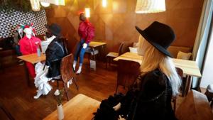 Mannequins dressed in creations of local designer sit at the tables in a restaurant during the coronavirus disease (COVID-19) outbreak in Vilnius, Lithuania May 21, 2020. REUTERS/Ints Kalnins (REUTERS) Mannequins dressed in creations of local designer sit at the tables in a restaurant during the coronavirus disease (COVID-19) outbreak in Vilnius, Lithuania May 21, 2020. REUTERS/Ints Kalnins (REUTERS)