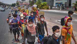 Migrants walk along the Chennai-Kolkata highway to reach to their native places in Chhattisgarh and Jharkhand, during the ongoing COVID-19 nationwide lockdown, in Vijayawada, Tuesday, May 19, 2020/ representative.(PTI) Migrants walk along the Chennai-Kolkata highway to reach to their native places in Chhattisgarh and Jharkhand, during the ongoing COVID-19 nationwide lockdown, in Vijayawada, Tuesday, May 19, 2020/ representative.(PTI)