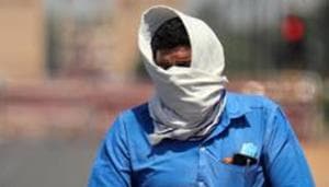 A man covers his face as he rides a bicycle during the heatwave in New Delhi on May, 25.(ANI) A man covers his face as he rides a bicycle during the heatwave in New Delhi on May, 25.(ANI)
