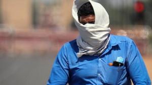 A man covers his face as he rides a bicycle during the heatwave in New Delhi on Monday.(ANI File Photo) A man covers his face as he rides a bicycle during the heatwave in New Delhi on Monday.(ANI File Photo)