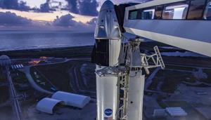In a photo provided by SpaceX, SpaceX's Dragon crew capsule sits atop a Falcon 9 rocket Sunday morning, May 24, 2020, at Cape Canaveral, Florida. SpaceX will attempt to launch NASA astronauts Doug Hurley and Bob Behnken to the International Space Station on Wednesday — a first for a private company.(AP) In a photo provided by SpaceX, SpaceX's Dragon crew capsule sits atop a Falcon 9 rocket Sunday morning, May 24, 2020, at Cape Canaveral, Florida. SpaceX will attempt to launch NASA astronauts Doug Hurley and Bob Behnken to the International Space Station on Wednesday — a first for a private company.(AP)