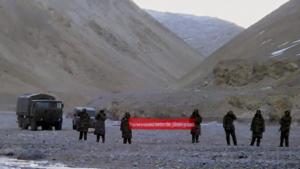 In this May 5, 2013 photo, Chinese troops in Ladakh hold a banner that asked Indian troops to move back.(AP Photo) In this May 5, 2013 photo, Chinese troops in Ladakh hold a banner that asked Indian troops to move back.(AP Photo)