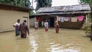 People outside their house in a flood-affected village in Nalbari district of Assam.(PTI) People outside their house in a flood-affected village in Nalbari district of Assam.(PTI)
