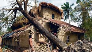 A man stands next to a house damaged in Cyclone Amphan in Sunderbans region’s Sagar island.(by special arrangement) A man stands next to a house damaged in Cyclone Amphan in Sunderbans region’s Sagar island.(by special arrangement)
