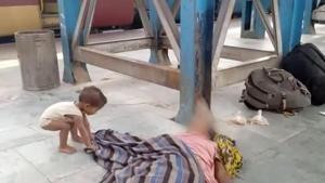A grab from the video which shows a toddler trying to wake up his dead mother at a railway station in Bihar.(PTI Photo) A grab from the video which shows a toddler trying to wake up his dead mother at a railway station in Bihar.(PTI Photo)