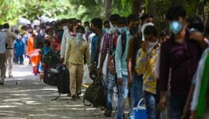 Migrants wait to get screened and register for transit buses that will ferry them to railway stations for Shramik Special trains, at Vasant Kunj in New Delhi on Thursday.(Amal KS/HT PHOTO) Migrants wait to get screened and register for transit buses that will ferry them to railway stations for Shramik Special trains, at Vasant Kunj in New Delhi on Thursday.(Amal KS/HT PHOTO)