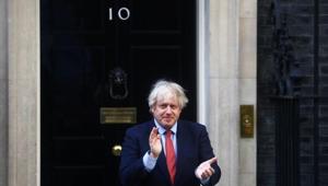 Britain's Prime Minister Boris Johnson applauds outside 10 Downing Street during the Clap for our Carers campaign in support of the NHS.(REUTERS) Britain's Prime Minister Boris Johnson applauds outside 10 Downing Street during the Clap for our Carers campaign in support of the NHS.(REUTERS)