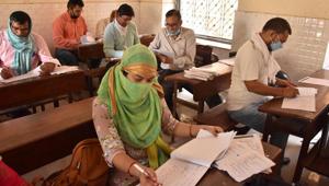 Teachers check answer sheets of students who appeared for the Uttar Pradesh Board examinations at a centre during the nationwide lockdown in Mathura. (Image used for representation).(PTI PHOTO.) Teachers check answer sheets of students who appeared for the Uttar Pradesh Board examinations at a centre during the nationwide lockdown in Mathura. (Image used for representation).(PTI PHOTO.)