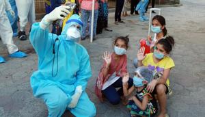 A doctor takes a selfie with children who were infected with Covid-19 before they are discharged following their recovery from the coronavirus disease at the Aurbindo hospital in Indore.(ANI File Photo) A doctor takes a selfie with children who were infected with Covid-19 before they are discharged following their recovery from the coronavirus disease at the Aurbindo hospital in Indore.(ANI File Photo)
