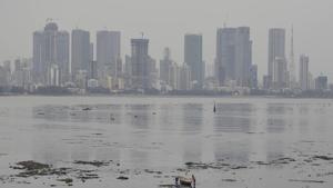 Fishermen with their boat at Mahim Beach as red alert is issued due to the possibility of Cyclone Nisarga, in Mumbai, Tuesday, June 2, 2020.(PTI photo) Fishermen with their boat at Mahim Beach as red alert is issued due to the possibility of Cyclone Nisarga, in Mumbai, Tuesday, June 2, 2020.(PTI photo)