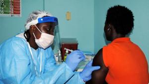 File Photo: A health worker injects a woman with an Ebola vaccine during a trial in Monrovia.(Reuters File Photo) File Photo: A health worker injects a woman with an Ebola vaccine during a trial in Monrovia.(Reuters File Photo)