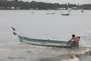 A fisherman pulls his boat out of sea to anchor it before cyclone Nisarga makes its landfall, in Mumbai, India.(Photo: Reuters) A fisherman pulls his boat out of sea to anchor it before cyclone Nisarga makes its landfall, in Mumbai, India.(Photo: Reuters)
