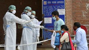New Delhi: Medics at a government hospital check papers of coronavirus positive patients during ongoing Covid-19 lockdown.(PTI) New Delhi: Medics at a government hospital check papers of coronavirus positive patients during ongoing Covid-19 lockdown.(PTI)