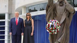 U.S. President Donald Trump and first lady Melania Trump pose beside a statue of Pope John Paul II as they visit the Saint John Paul II National Shrine in Washington, U.S., June 2, 2020. REUTERS/Tom Brenner(REUTERS) U.S. President Donald Trump and first lady Melania Trump pose beside a statue of Pope John Paul II as they visit the Saint John Paul II National Shrine in Washington, U.S., June 2, 2020. REUTERS/Tom Brenner(REUTERS)