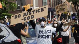Omar Fernandez takes part in the Prayerful Protest march for George Floyd in the Brooklyn borough of New York. Floyd died after being restrained by Minneapolis police officers on Memorial Day, May 25.(AP Photo) Omar Fernandez takes part in the Prayerful Protest march for George Floyd in the Brooklyn borough of New York. Floyd died after being restrained by Minneapolis police officers on Memorial Day, May 25.(AP Photo)