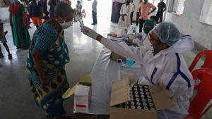 Thane, India - MAY.31,2020: Thane Municipal corporation's healthcare Workers and Doctors do thermal screening during free medical camp in Thane during Covid 19 pandemic in Dharmaveer Nagar at Thane, Mumbai ,India, Sunday,May,31,2020.(Praful Gangurde/HT Photo) Thane, India - MAY.31,2020: Thane Municipal corporation's healthcare Workers and Doctors do thermal screening during free medical camp in Thane during Covid 19 pandemic in Dharmaveer Nagar at Thane, Mumbai ,India, Sunday,May,31,2020.(Praful Gangurde/HT Photo)