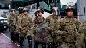 US Army soldiers arrive to maintain a perimeter during a rally against the death in Minneapolis police custody of George Floyd.(REUTERS) US Army soldiers arrive to maintain a perimeter during a rally against the death in Minneapolis police custody of George Floyd.(REUTERS)