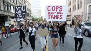 People take part in a protest in response to the death in Minneapolis police custody of George Floyd, in Los Angeles, California on Wednesday.(Reuters Photo) People take part in a protest in response to the death in Minneapolis police custody of George Floyd, in Los Angeles, California on Wednesday.(Reuters Photo)