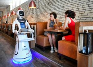 A robot serves in a Chinese restaurant to reduce the risk of spreading the coronavirus disease (COVID-19) in Maastricht, Netherlands.(Reuters) A robot serves in a Chinese restaurant to reduce the risk of spreading the coronavirus disease (COVID-19) in Maastricht, Netherlands.(Reuters)