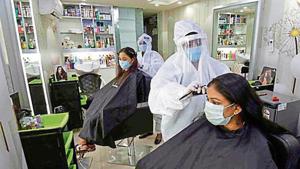 Staff at a Patna salon work wearing PPE. Staff at a Patna salon work wearing PPE.