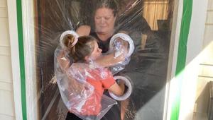 Hug curtain made by 10-year-old Paige to be able to maintain physical contact with her grandparent who is a nurse Hug curtain made by 10-year-old Paige to be able to maintain physical contact with her grandparent who is a nurse