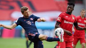 Bayer Leverkusen’s Edmond Tapsoda in action with Bayern Munich’s Thomas Muller.(Reuters) Bayer Leverkusen’s Edmond Tapsoda in action with Bayern Munich’s Thomas Muller.(Reuters)