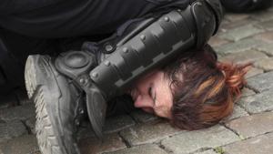 In this file photo, police detain a woman during a yellow vest protest with other groups in Brussels. The death of George Floyd has renewed scrutiny of immobilization techniques long used in policing around the world.(AP) In this file photo, police detain a woman during a yellow vest protest with other groups in Brussels. The death of George Floyd has renewed scrutiny of immobilization techniques long used in policing around the world.(AP)