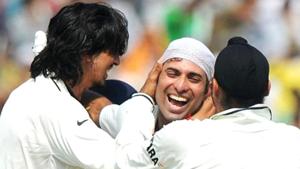 Teammates Ishant Sharma(L)and Harbhajan Singh (R) congratulate VVS Laxman(AFP) Teammates Ishant Sharma(L)and Harbhajan Singh (R) congratulate VVS Laxman(AFP)