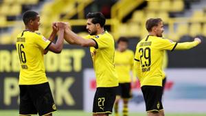 Borussia Dortmund v Hertha BSC - Signal Iduna Park, Dortmund, Germany - June 6, 2020 Borussia Dortmund's Emre Can, Manuel Akanji and Marcel Schmelzer celebrate after the match.(REUTERS) Borussia Dortmund v Hertha BSC - Signal Iduna Park, Dortmund, Germany - June 6, 2020 Borussia Dortmund's Emre Can, Manuel Akanji and Marcel Schmelzer celebrate after the match.(REUTERS)