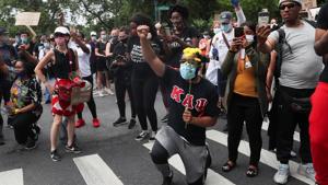 A demonstrator takes a knee during a protest against the death in Minneapolis police custody of George Floyd, in New York City, New York, US.(REUTERS) A demonstrator takes a knee during a protest against the death in Minneapolis police custody of George Floyd, in New York City, New York, US.(REUTERS)