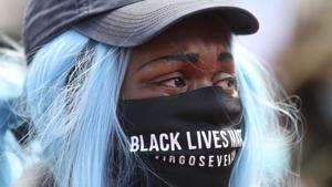 A demonstrator wearing a protective face mask during a Black Lives Matter protest in Leicester, following the death of George Floyd who died in police custody in Minneapolis, Leicester, Britain(REUTERS) A demonstrator wearing a protective face mask during a Black Lives Matter protest in Leicester, following the death of George Floyd who died in police custody in Minneapolis, Leicester, Britain(REUTERS)