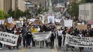 Protesters march up Monroe Street during a Black Lives Matter protest organized by Occupy Spokane and the NAACP, in downtown Spokane, Wash., Sunday, June 7, 2020. (Tyler Tjomsland/The Spokesman-Review via AP)(AP) Protesters march up Monroe Street during a Black Lives Matter protest organized by Occupy Spokane and the NAACP, in downtown Spokane, Wash., Sunday, June 7, 2020. (Tyler Tjomsland/The Spokesman-Review via AP)(AP)