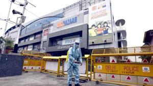 New Delhi, India - June 04, 2020: A worker wearing PPE sprays chemical disinfectant at V3S Mall premises, in Laxmi Nagar, New Delhi(Sonu Mehta/HT PHOTO) New Delhi, India - June 04, 2020: A worker wearing PPE sprays chemical disinfectant at V3S Mall premises, in Laxmi Nagar, New Delhi(Sonu Mehta/HT PHOTO)