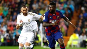 Soccer Football - La Liga Santander - Real Madrid v Barcelona - Santiago Bernabeu, Madrid, Spain - March 1, 2020 Barcelona's Samuel Umtiti in action with Real Madrid's Karim Benzema REUTERS/Juan Medina(REUTERS) Soccer Football - La Liga Santander - Real Madrid v Barcelona - Santiago Bernabeu, Madrid, Spain - March 1, 2020 Barcelona's Samuel Umtiti in action with Real Madrid's Karim Benzema REUTERS/Juan Medina(REUTERS)