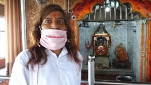A masked priest at the revered shrine of Mata Chandi Devi in Haridwar(HT Photo) A masked priest at the revered shrine of Mata Chandi Devi in Haridwar(HT Photo)