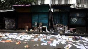 Wet damp books lying on the street to dry in the aftermath of Cyclone Amphan at College Street in Kolkata.(SAMIR JANA/HT PHOTO.)