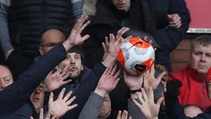Fans stop the match ball after it is kicked into the stands.(Action Images via Reuters) Fans stop the match ball after it is kicked into the stands.(Action Images via Reuters)