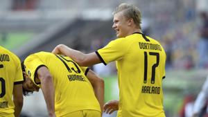 Dortmund's Erling Haaland, right, celebrates after scoring the opening goal during the German Bundesliga soccer match between Fortuna Duesseldorf and Borussia Dortmund in Duesseldorf.(AP) Dortmund's Erling Haaland, right, celebrates after scoring the opening goal during the German Bundesliga soccer match between Fortuna Duesseldorf and Borussia Dortmund in Duesseldorf.(AP)
