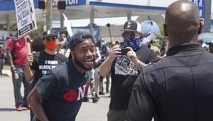 Protestors hold a demonstration near the Wendy's fast food restaurant in Atlanta on Saturday, June 13, 2020.(AP photo) Protestors hold a demonstration near the Wendy's fast food restaurant in Atlanta on Saturday, June 13, 2020.(AP photo)