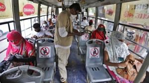 People board a city bus in Ahmedabad on Wednesday.(AP Photo) People board a city bus in Ahmedabad on Wednesday.(AP Photo)