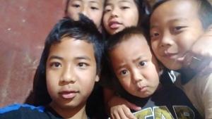 Isaac Paulallungmuan Vaiphei (in blue) with his brothers and sisters. Isaac Paulallungmuan Vaiphei (in blue) with his brothers and sisters.