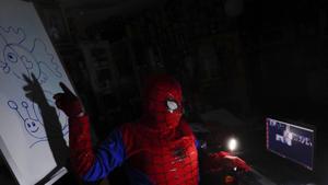 Art teacher Jorge Manolo Villarroel, wearing a Spider-Man costume, teaches an online class from his home, amid the new coronavirus pandemic in La Paz, Bolivia.(AP) Art teacher Jorge Manolo Villarroel, wearing a Spider-Man costume, teaches an online class from his home, amid the new coronavirus pandemic in La Paz, Bolivia.(AP)